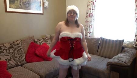 Miss Santa Doing a Sexy Striptease Showing Big Boobs