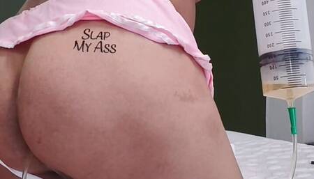 Sissy giving herself a 1l beer enema with her boobs out