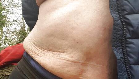 Half naked under a coat