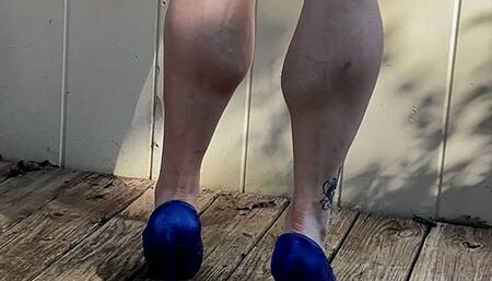 Jazzy on her deck, posing her muscular calves