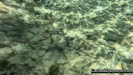 Carissa snorkling in the red catsuit in the public springs