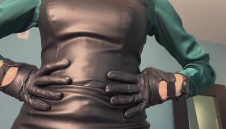 Hot blonde in a satin blouse and leather dress