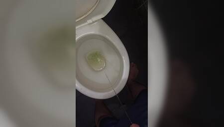 Peeing in the toilet with catheter in penis