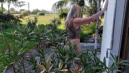 Martina in a Shiny Leopard Swimsuit