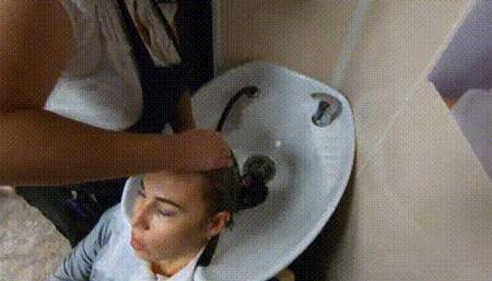 Hair washing in salon in leather pants