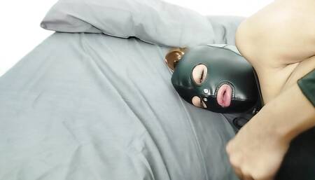 Petty BDSM slut playing with her wet pussy whipped by her master with slave leather mask until orgasm
