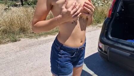 a woman undresses in the middle of the road and walks naked down the street