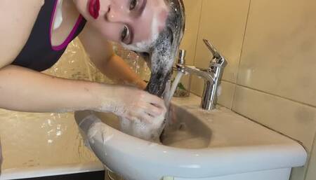 hair washing in the sink with lots of shampoo