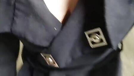 Beautiful girl with big trying on a dress walks from the store booth to her car in the parking lot without lingerie.