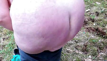 Complete naked girl in the woods and whipping her body and genitals