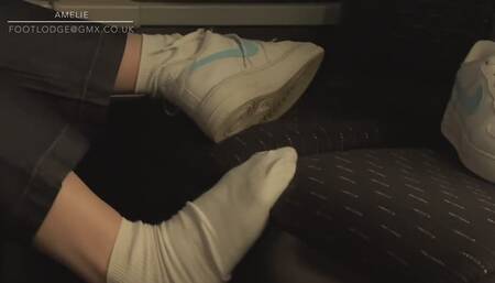 Amelie removes her Nike AF1 sneakers on the bus filmed candidly