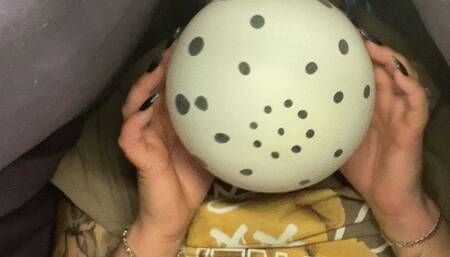 I'm sitting under the blanket and popping balloons