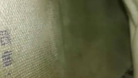 Sneakers with a lot of odor, worn by a young woman.