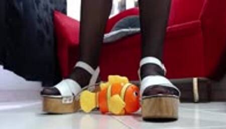 crushing a toyfish nemo in pieces with my wooden platform sandals heels