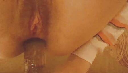 Teen fucks anal with a big rubber dildo