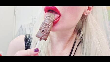 Licking a chocolate lollipop