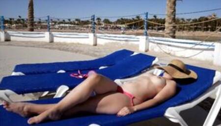 Hot Girl laying Naked on a Public beach - jerking off and letting a guy cum on her perfect ass