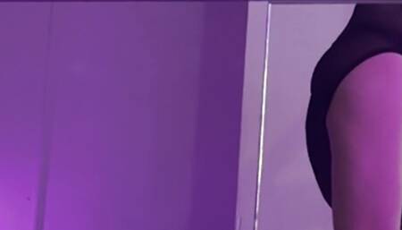 stretching with pylon in bodysuit