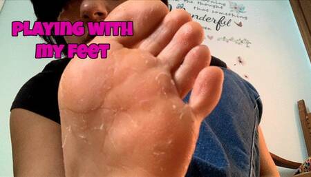 I play with my feet sitting on the floor