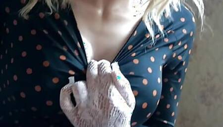 Shemale twists her ass in front of the window, seducing random passers-by and walks in the entrance dressed in women's clothes