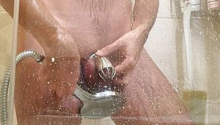 Taking shower while locked in chastity cage