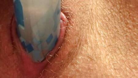 Close up- zoomed giving pleasure with a glue stick.