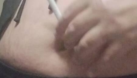 Playing with my belly button while smoke