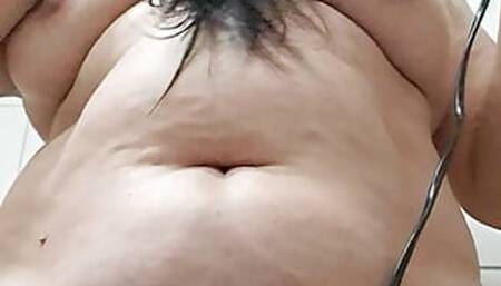 Mature milf drying her hair and is naked