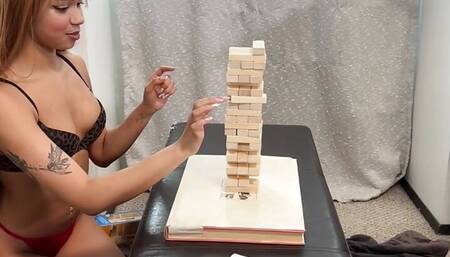 Pleasing her with a sex toy after she won a Tall Tumble Tower Strip game