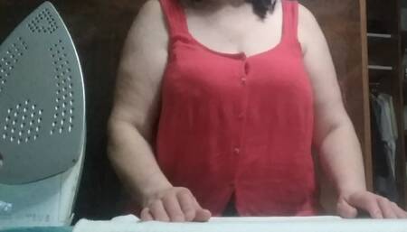 Stepmom, 57 years old, with Big Natural Tits, irons clothes and has a secret video call with her Stepson.