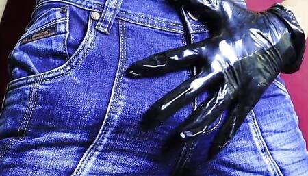 sexy guy in jeans and gloves caresses his big hot cock