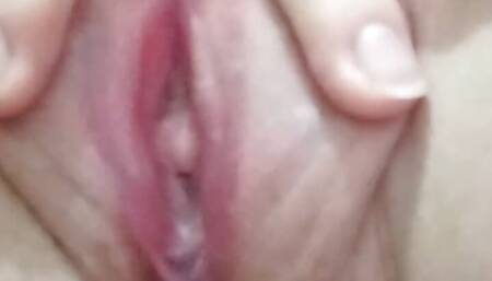 She moans loudly while her pussy spurts a white liquid from the inside, it looks like semen.