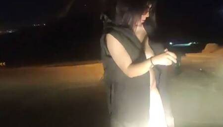 Naked woman exposes herself on the street.