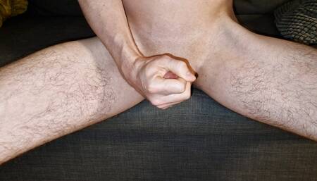 Handjob while sitting ends with big cumshot