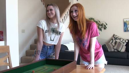 A couple of sexy skinny girls playing a strip craps game with their friend