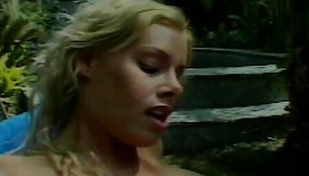 Beautiful big boobed blonde rides big dick in the jungle