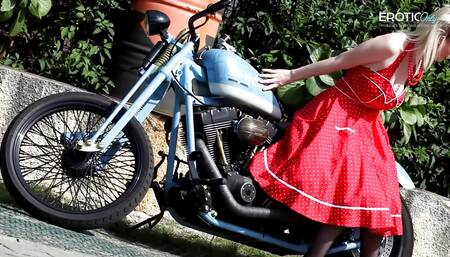 German blonde camgirl dangles her boobs on the motorcycle, and after that she makes a show at EroticOnly!