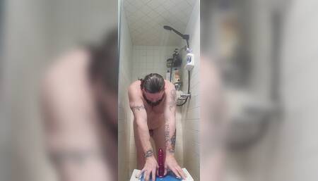 Chubby white guy Neil sucks and fucks dildo in the shower